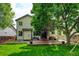 Back of house featuring a backyard with a patio and a swing set at 7245 Prairie Cir, Longmont, CO 80504