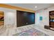 Finished basement with painted walls, wood-look floors, and ample lighting, perfect for activities at 7245 Prairie Cir, Longmont, CO 80504