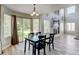 Well-lit dining area with access to the back yard and great views of the fireplace at 7245 Prairie Cir, Longmont, CO 80504