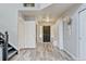 Bright foyer with wood-look floors, closet, and stylish decor creating a welcoming entry at 7245 Prairie Cir, Longmont, CO 80504