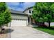 Charming home featuring a two-car garage, driveway, and mature landscaping enhancing its curb appeal at 7245 Prairie Cir, Longmont, CO 80504