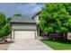 Charming home featuring a two-car garage, driveway, and mature landscaping enhancing its curb appeal at 7245 Prairie Cir, Longmont, CO 80504