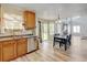 Inviting kitchen with wood cabinets, stainless steel dishwasher, and dining table visible at 7245 Prairie Cir, Longmont, CO 80504