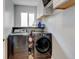 Laundry room features modern washer and dryer, providing convenience and efficiency at 7245 Prairie Cir, Longmont, CO 80504