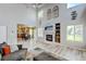 Bright open concept living room with fireplace, kitchen, and dining room views at 7245 Prairie Cir, Longmont, CO 80504