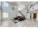 Bright living room featuring staircase with iron railings, high ceilings and comfortable seating at 7245 Prairie Cir, Longmont, CO 80504