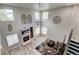 Bright open living room with high ceilings, fireplace, large windows and modern decor at 7245 Prairie Cir, Longmont, CO 80504