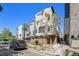Daytime view of a modern townhouse with sleek lines and minimalist landscaping at 5610 S Sycamore St, Littleton, CO 80120