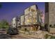 Modern townhouse exterior with contemporary design and professional landscaping under a twilight sky at 5610 S Sycamore St, Littleton, CO 80120