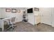 Home office with desk, shelving, and decorative wall hangings, offers a functional workspace at 5610 S Sycamore St, Littleton, CO 80120