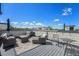 Comfortable rooftop deck with ample seating, ideal for enjoying city views and outdoor living at 5610 S Sycamore St, Littleton, CO 80120