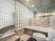 Bathroom with large bathtub and glass block feature at 1020 15Th St # 42C, Denver, CO 80202