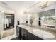 Elegant bathroom with double vanity and walk-in closet at 1020 15Th St # 42C, Denver, CO 80202