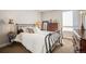 Charming bedroom with a metal bed frame at 1020 15Th St # 42C, Denver, CO 80202