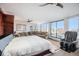 Bright bedroom with city views and relaxing seating at 1020 15Th St # 42C, Denver, CO 80202