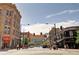 Downtown city street with storefronts and busy traffic at 1020 15Th St # 42C, Denver, CO 80202