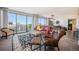 Bright living room featuring a red leather sofa and city views at 1020 15Th St # 42C, Denver, CO 80202