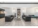Lobby sitting area with modern black couches and a painting at 1020 15Th St # 42C, Denver, CO 80202