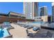 Rooftop pool deck offers lounge chairs and scenic city views at 1020 15Th St # 42C, Denver, CO 80202