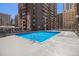 Refreshing rooftop pool with plenty of lounge chairs at 1020 15Th St # 42C, Denver, CO 80202