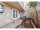 Enclosed back porch featuring double french doors, exterior wall light, and a concrete step at 141 S Fraser Cir, Aurora, CO 80012