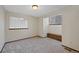 Bedroom with carpet flooring, window bench seat, and unique glass block window at 141 S Fraser Cir, Aurora, CO 80012