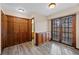 Bedroom showcasing closet space and natural light from access to outdoor patio at 141 S Fraser Cir, Aurora, CO 80012