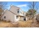 Charming two-story home featuring beige siding, a low-sloped roof, and a well-maintained small yard at 141 S Fraser Cir, Aurora, CO 80012