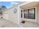 Attractive front entrance features a stained-glass window and covered porch at 141 S Fraser Cir, Aurora, CO 80012