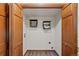 Functional laundry room with shelving, utility hookups, and wood-style flooring at 141 S Fraser Cir, Aurora, CO 80012