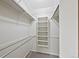 Spacious walk-in closet with ample shelving and metal rods for organized storage solutions at 141 S Fraser Cir, Aurora, CO 80012