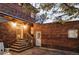 Backyard with brick wall, steps, and door at 626 Fillmore St, Denver, CO 80206