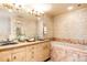 Elegant bathroom with double vanities and a large soaking tub at 626 Fillmore St, Denver, CO 80206