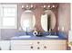 Bathroom with double vanity and oval mirrors at 626 Fillmore St, Denver, CO 80206