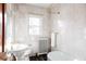 Classic bathroom with white fixtures and marble flooring at 626 Fillmore St, Denver, CO 80206