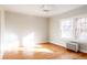 Light-filled bedroom with hardwood floors and large windows at 626 Fillmore St, Denver, CO 80206