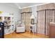 Bedroom with rocking chair, bookshelves, and window seating at 626 Fillmore St, Denver, CO 80206