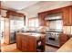 Gourmet kitchen boasting stainless steel appliances and wood cabinetry at 626 Fillmore St, Denver, CO 80206