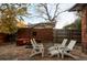 Stone patio with seating area and umbrella at 626 Fillmore St, Denver, CO 80206