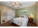 Cozy bedroom with natural light, a ceiling fan, and closet for storage at 8701 Majestic View Dr, Conifer, CO 80433