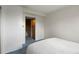 Bedroom featuring a simple design and an attached closet at 8701 Majestic View Dr, Conifer, CO 80433