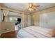 Bright bedroom with a ceiling fan and a view into another room, creating an open feel at 8701 Majestic View Dr, Conifer, CO 80433
