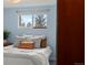Cozy bedroom with light blue walls, soft natural light, and comfortable bedding at 8701 Majestic View Dr, Conifer, CO 80433