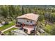 Mountain home on a rocky lot with a back deck at 8701 Majestic View Dr, Conifer, CO 80433