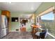Eat-in kitchen area features a breakfast nook with stunning views, stainless steel appliances, and a seamless pass-through to the living area at 8701 Majestic View Dr, Conifer, CO 80433