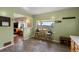 Eat-in kitchen area features a breakfast nook with stunning views, access to the living area, and a place to hang your coat at 8701 Majestic View Dr, Conifer, CO 80433