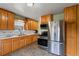 Well-lit kitchen features stainless steel appliances, ample cabinetry, and functional layout for easy meal preparation at 8701 Majestic View Dr, Conifer, CO 80433