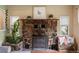 Charming living room boasts a stunning stone fireplace and mantel, creating a warm and inviting atmosphere at 8701 Majestic View Dr, Conifer, CO 80433