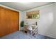 Bright office with desk, chair, and window with outdoor view, adjacent to large closet at 8701 Majestic View Dr, Conifer, CO 80433