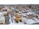 Aerial view of a house in a residential neighborhood, near city skyline at 3780 Benton St, Wheat Ridge, CO 80212